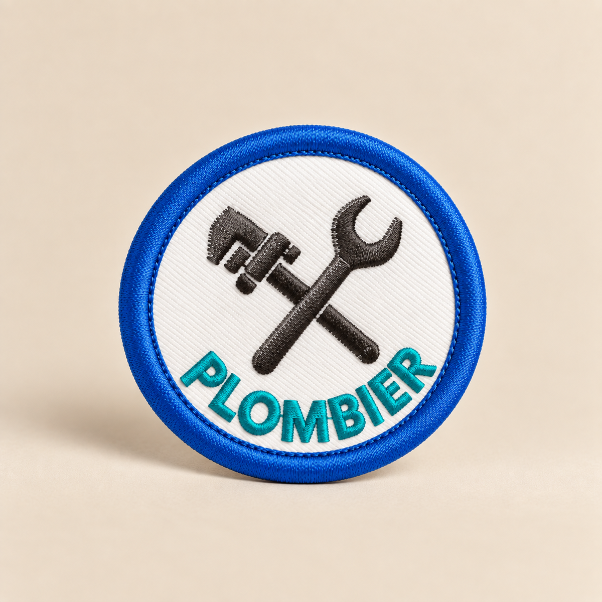 Badge plombier à scratcher